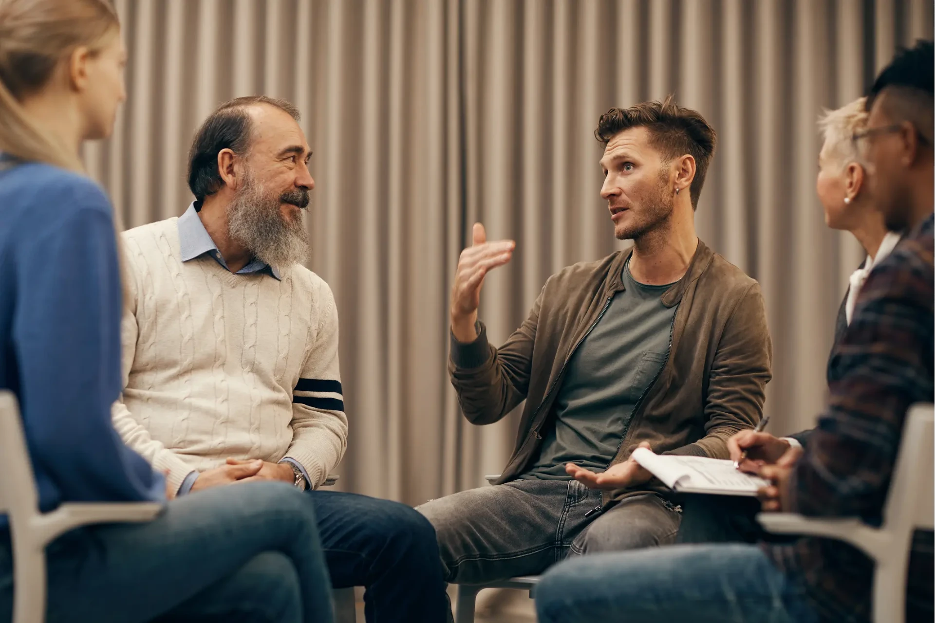 Christian leaders sitting in a circle discussing their ministry plans